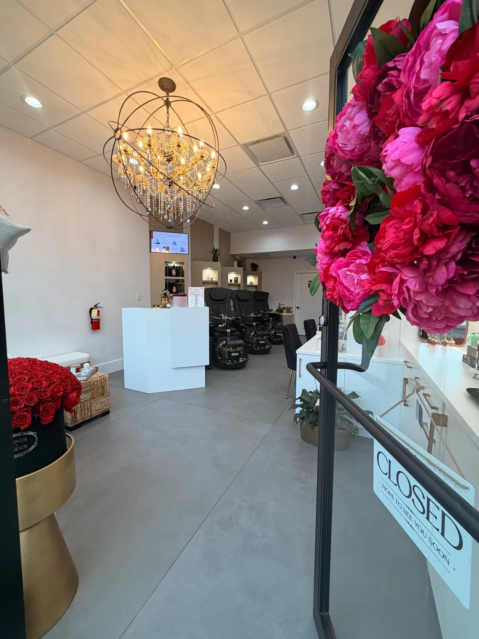 Inside Ridgewood Nail Club: a crystal orb chandelier, peonies, and the pedicure lounge.
